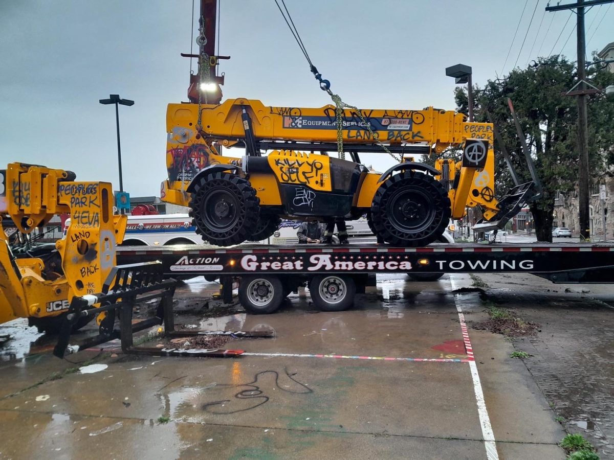 Construction equipment being hauled on a truck