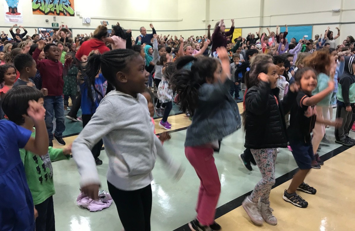 Sylvia Mendez Elementary students dance at a morning assembly in 2018. Their school was just renamed for a school desegregation icon. Photo: Natalie Orenstein